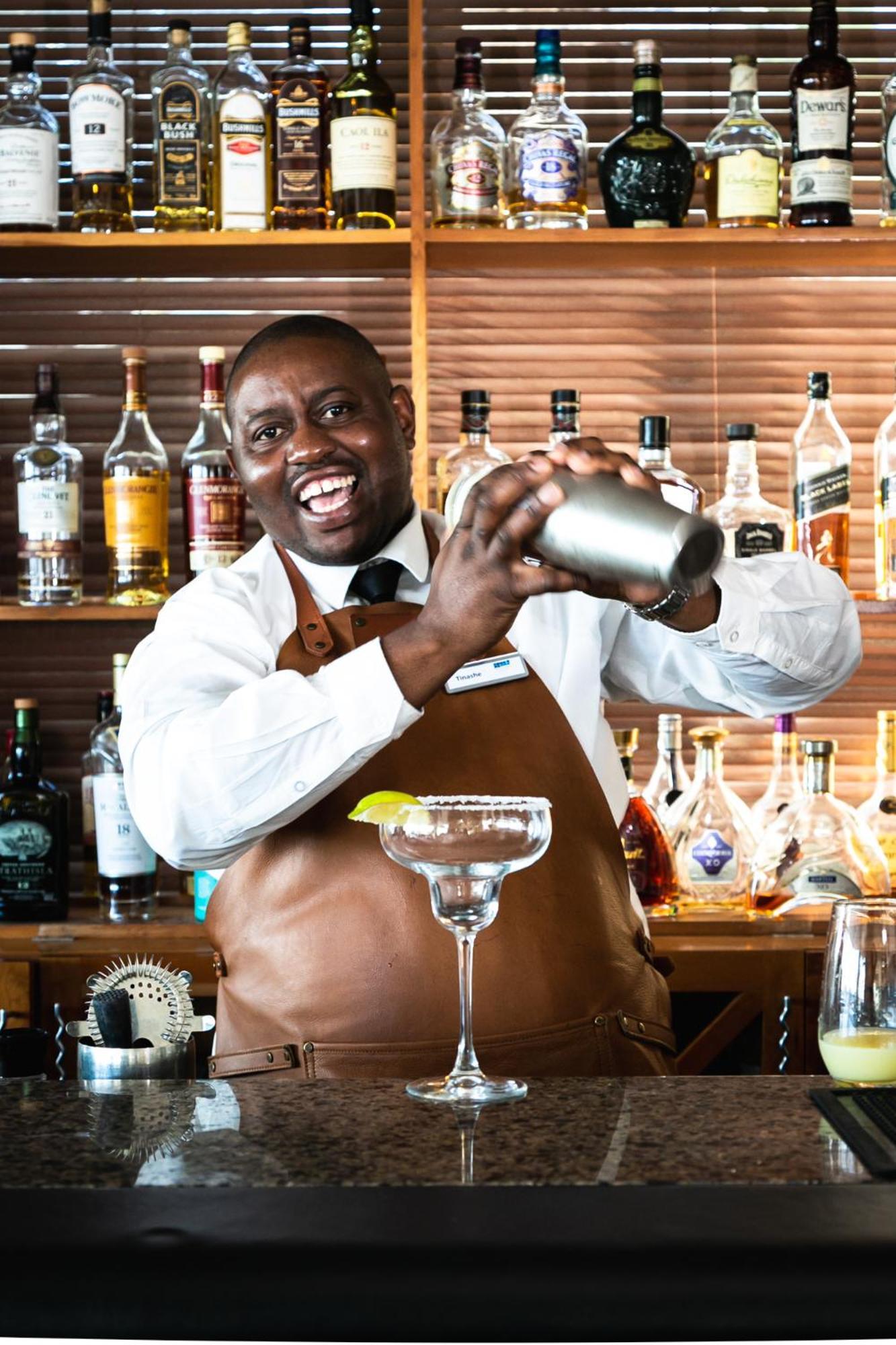 The Bay Hotel Cape Town Dış mekan fotoğraf A bartender shaking a cocktail